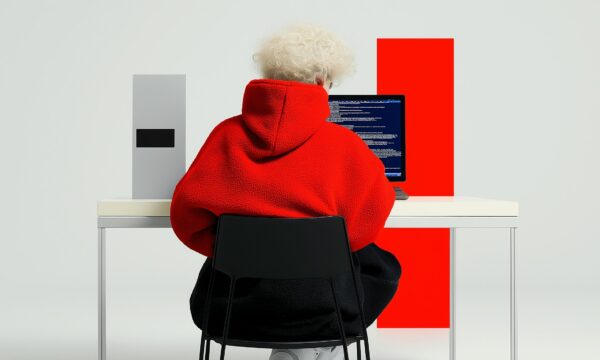 Person in Red Hoodie Coding
